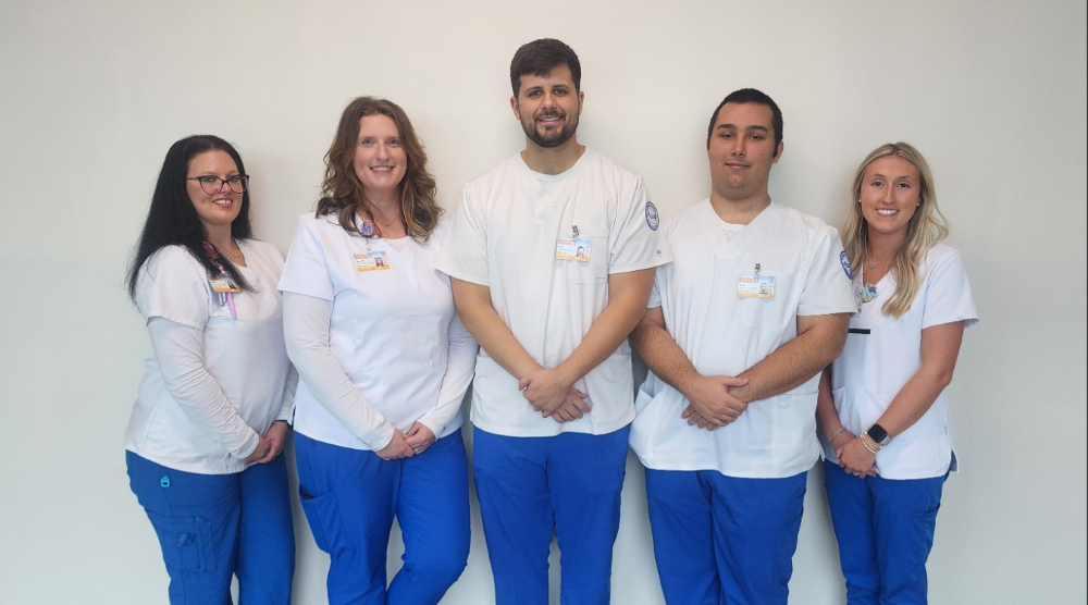 Cardiovascular sonography students wearing scrubs during their training program